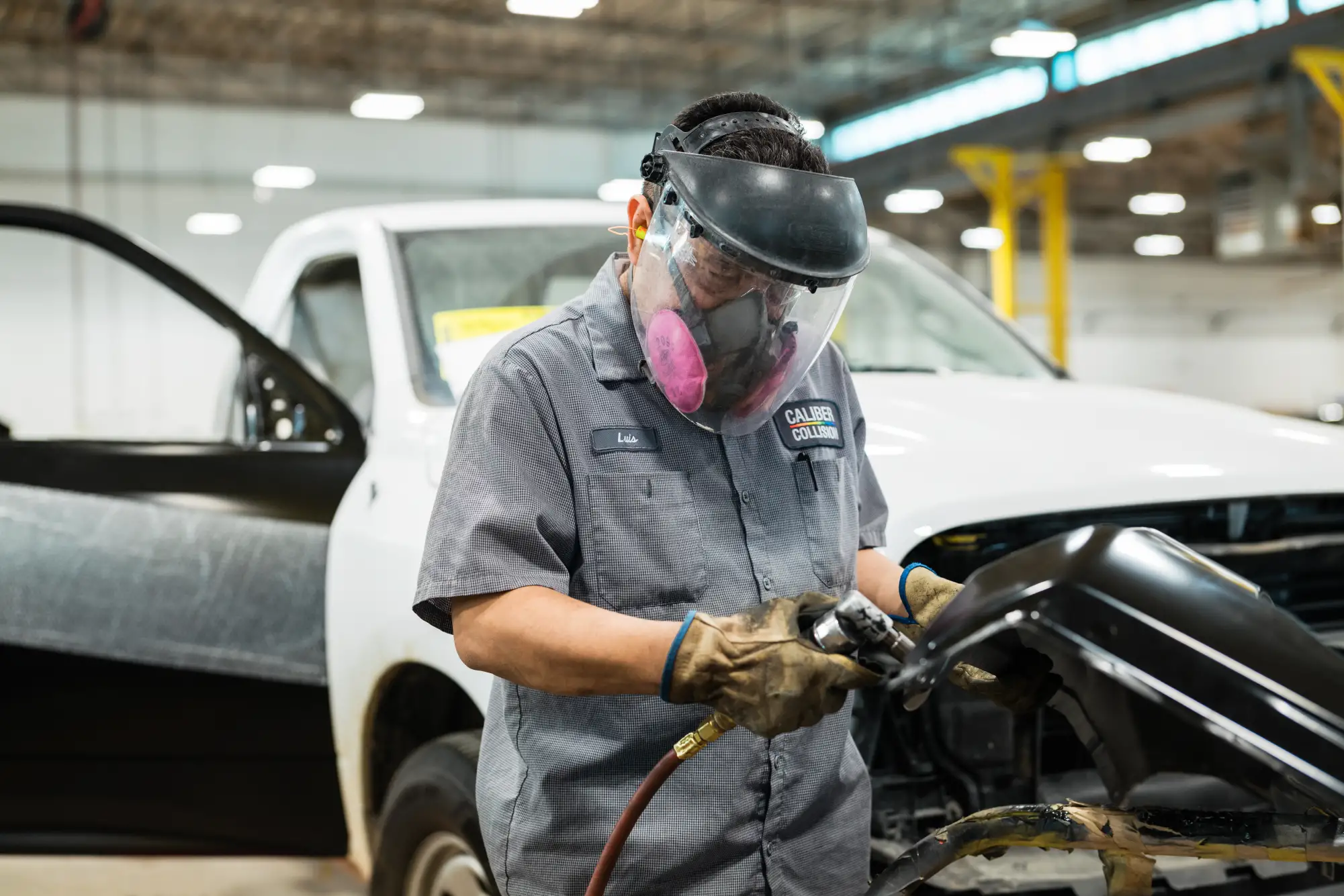 Caliber Collision Body Repair Tech in action.
